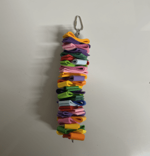 A colorful bird toy made of foam strips.
